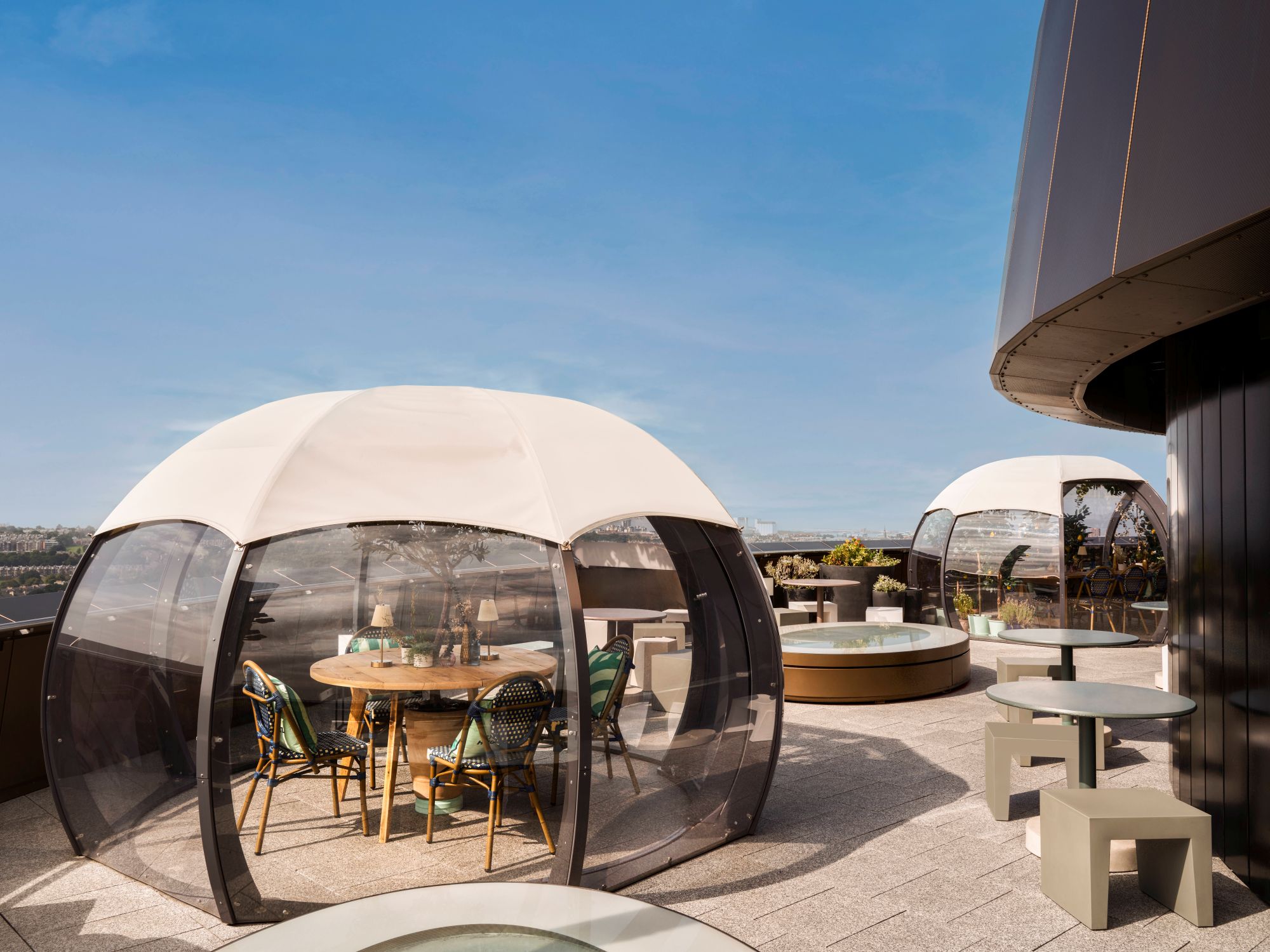 2 dining pods on hotel rooftop terrace