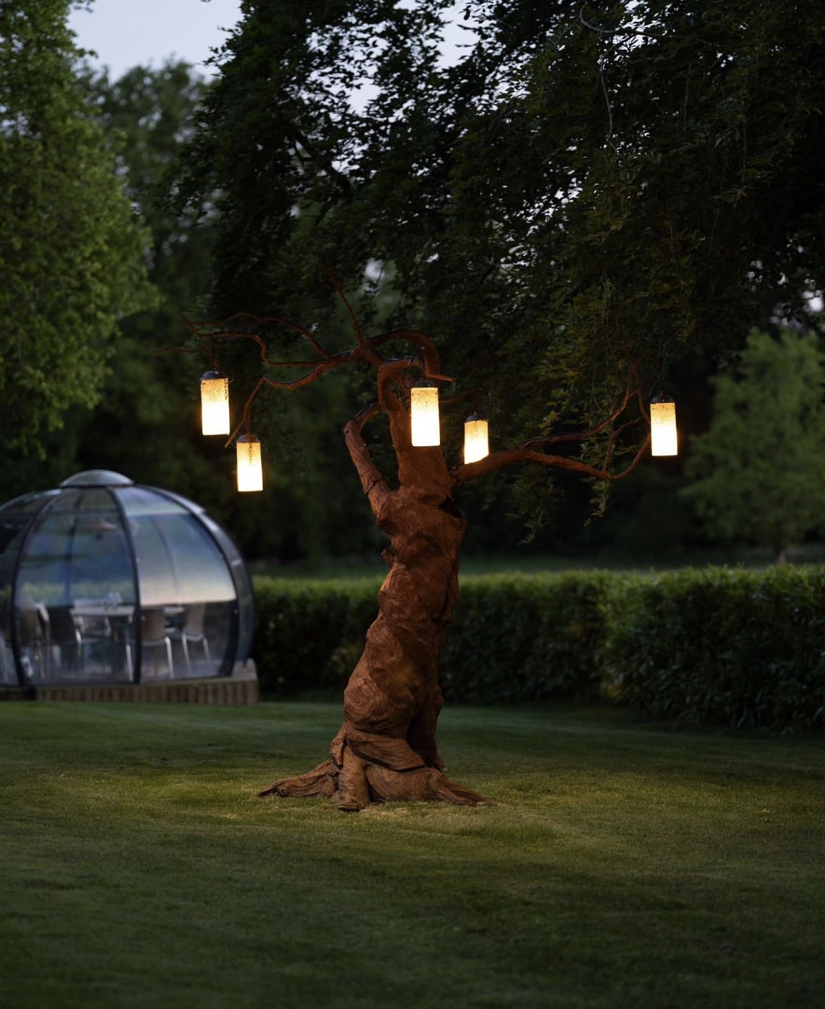 Garden dining pod at dusk 