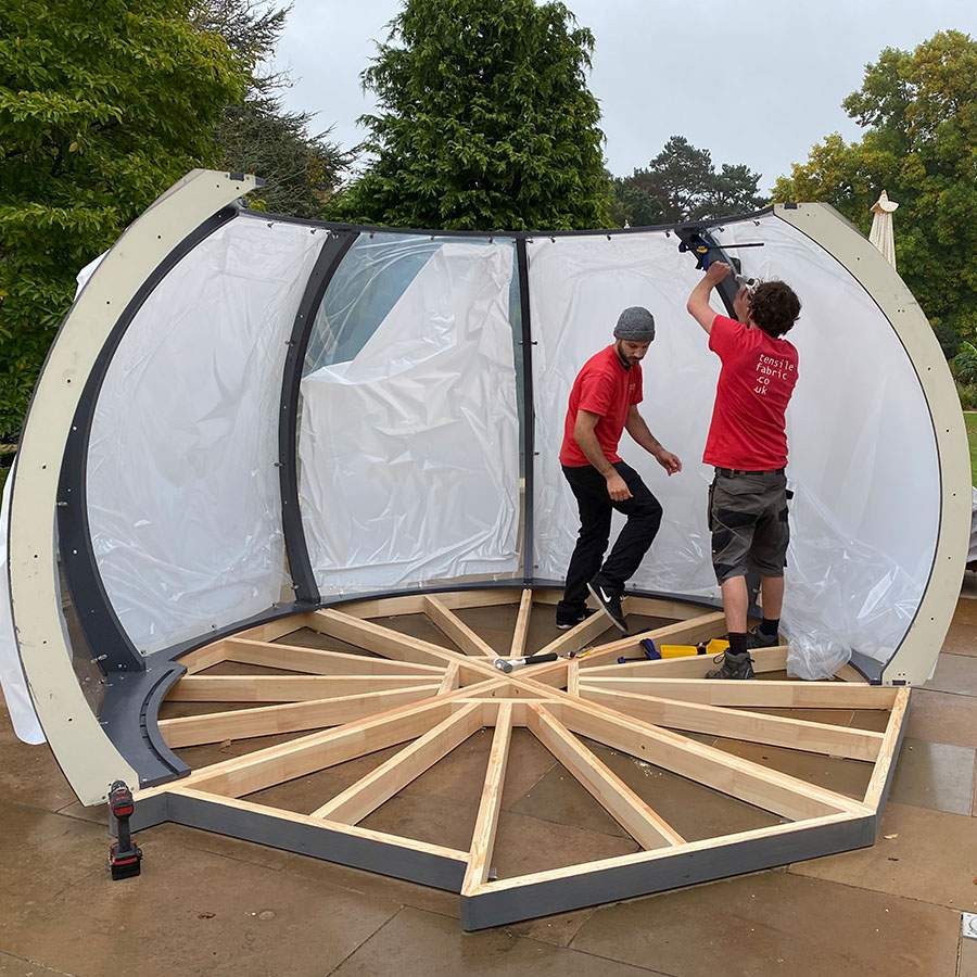 Our team setting up and installing the segments of a dining dome 