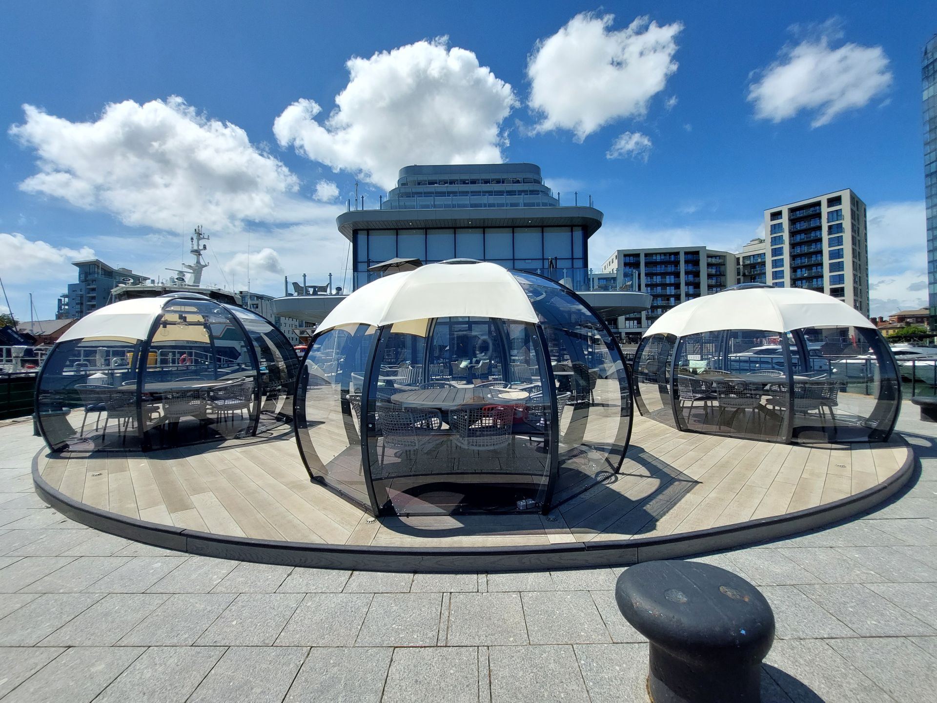 Dining domes at Southampton Harbour Hotel on wooden decked terrace 